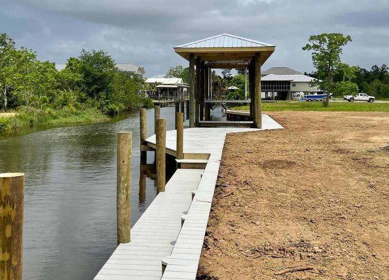 New boathouse with a walkway along a bulkhead