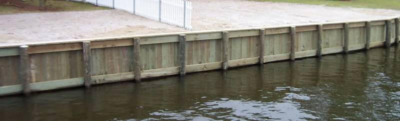 Wooden bulkhead along the water